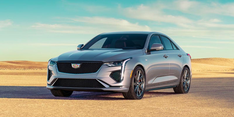 Cadillac Vehicle Parked In A Desert