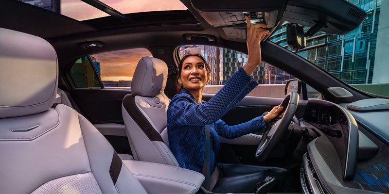 A Woman Sat In A Cadillac XT-4 Vehicle Having Nice Cockpit