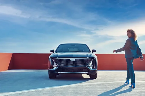 Woman next to Cadillac Lyriq